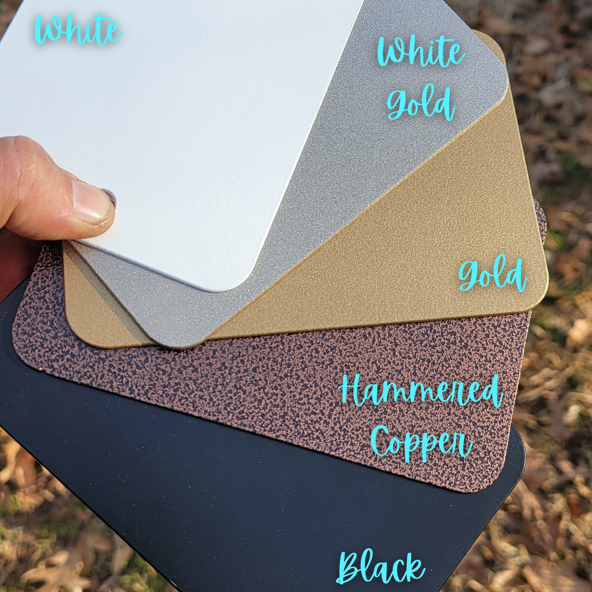 Powder coat color samples for the magnetic art bars: white, white gold, gold, hammered copper and black